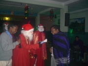 Fr. Prabhu Recieving his Christmas gift.